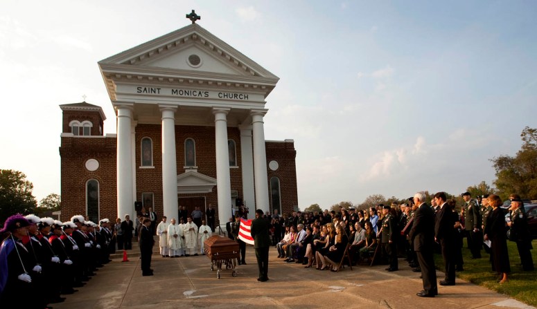 11/15/2009 - Jay Janner/AMERICAN-STATESMAN - Soldiers fold the flag to be presented to Joleen Cahill at the funeral for her husband Michael Cahill at St. Monica Catholic Church in Cameron, Texas, on Sunday Nov. 15, 2009.   Michael Cahill, 62, a physician's assistant, was killed in the mass shootings at Fort Hood.