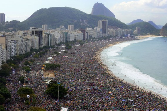 Millions of people crowd Copacabana beach in Rio de Janeiro on July 28, 2013 as Pope Francis celebrates the final mass of his visit to Brazil. Throngs of pilgrims attending World Youth Day (WYD) spent the night sleeping on the beach before Sunday's final mass, while the city's mayor said he expects up to three million people to pack the beach for the occasion.   AFP PHOTO / TASSO MARCELO        (Photo credit should read TASSO MARCELO/AFP/Getty Images)