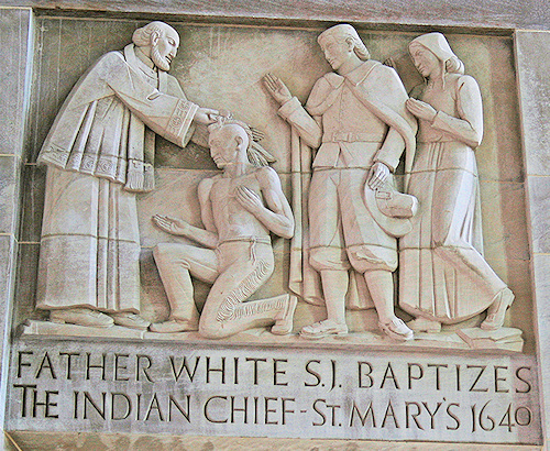 In a short 28 years later after the execution of Guy Fawkes, in what was to Become The United States Of America, Father Andrew White in 1634 stepped upon Maryland named after Henrietta Maria (King Charles 1~ Catholic Wife From France). On the day of the Annunciation of the Most Holy Virgin Mary, in the year 1634,” continues Father White, ” we celebrated on this island the first Mass which had been ever offered up in this part of the world.