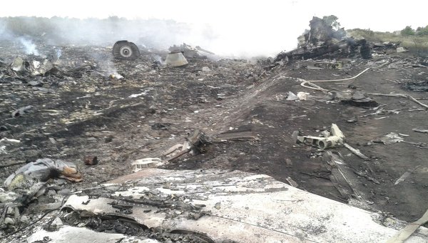 Emergencies Ministry members work at the site of a Malaysia Airlines Boeing 777 plane crash, July 17, 2014 