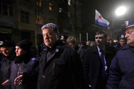Pro-Eastern Ukrainians recognize the Kiev Western Coup As An Act Against Ukraine's Constitution, force Western Ukrainian Petro Poroshenko out of Crimea's parliament building in Simferopol on Feb. 28, 2014