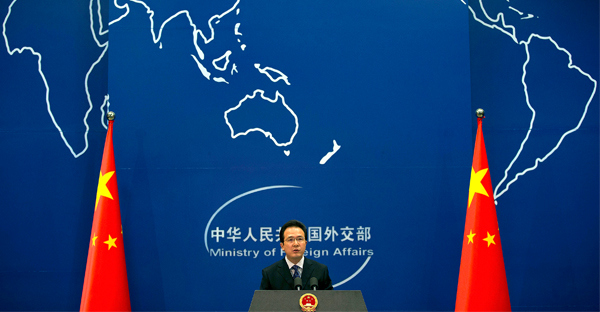 Foreign Ministry spokesman Hong Lei speaks during a daily briefing at the Ministry of Foreign Affairs office in Beijing